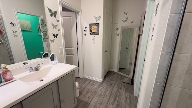 bathroom featuring hardwood / wood-style floors, vanity, and toilet