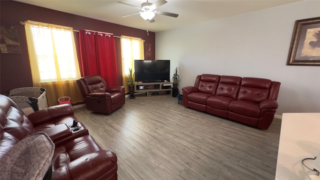 living room featuring hardwood / wood-style flooring and ceiling fan