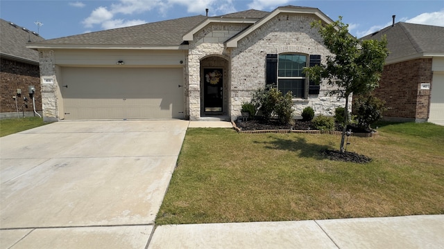 view of front of house with a garage and a front lawn