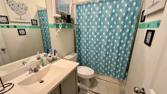 full bathroom featuring vanity, shower / bath combination with curtain, and toilet