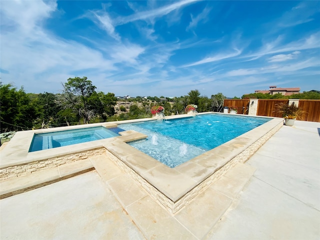 view of pool with an in ground hot tub and pool water feature