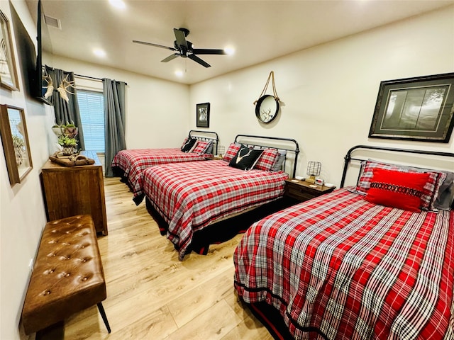 bedroom featuring ceiling fan and light hardwood / wood-style flooring