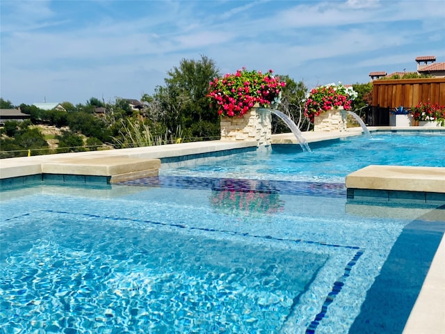 view of swimming pool featuring pool water feature