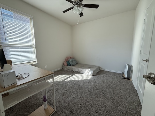 unfurnished bedroom with carpet, multiple windows, and ceiling fan