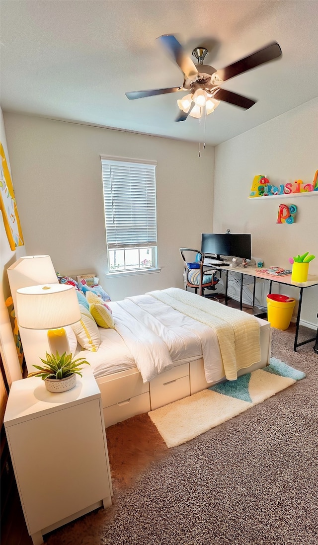 carpeted bedroom with ceiling fan