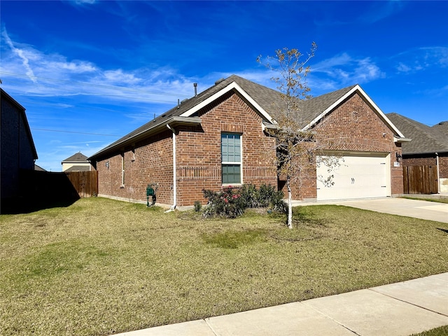 view of front of house with a garage and a front lawn