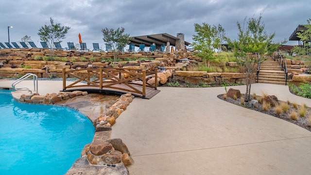 view of pool featuring pool water feature