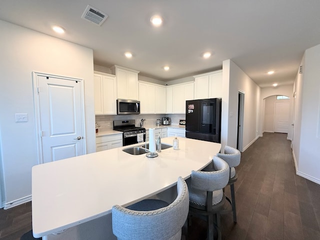 kitchen featuring white cabinets, sink, and stainless steel appliances