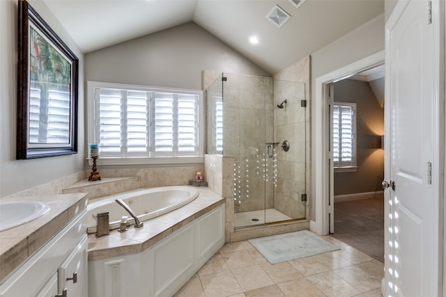 bathroom featuring tile patterned flooring, vanity, vaulted ceiling, and independent shower and bath