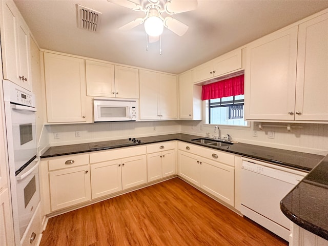 kitchen featuring ceiling fan, sink, light hardwood / wood-style flooring, white appliances, and white cabinets