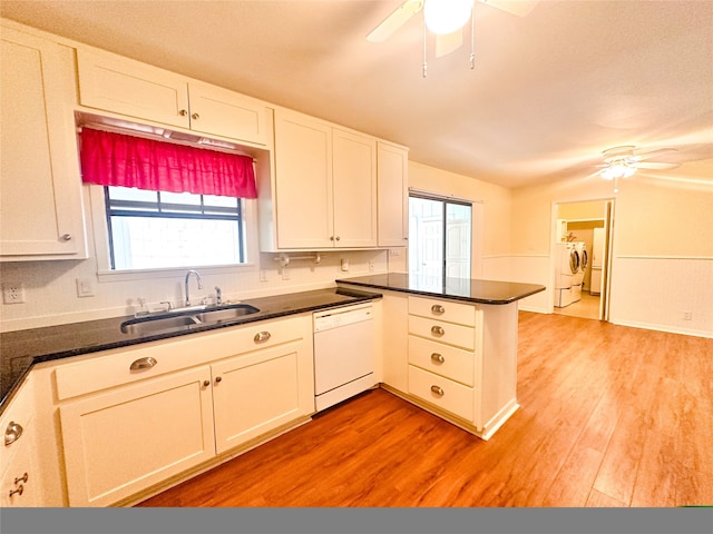 kitchen featuring white cabinetry, sink, and white dishwasher