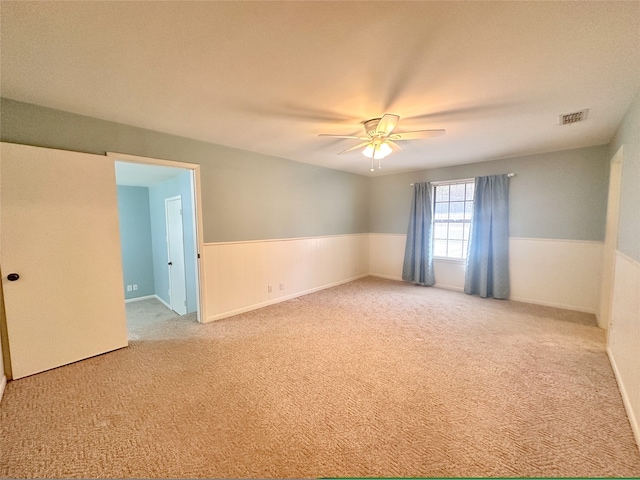 unfurnished room featuring carpet flooring and ceiling fan