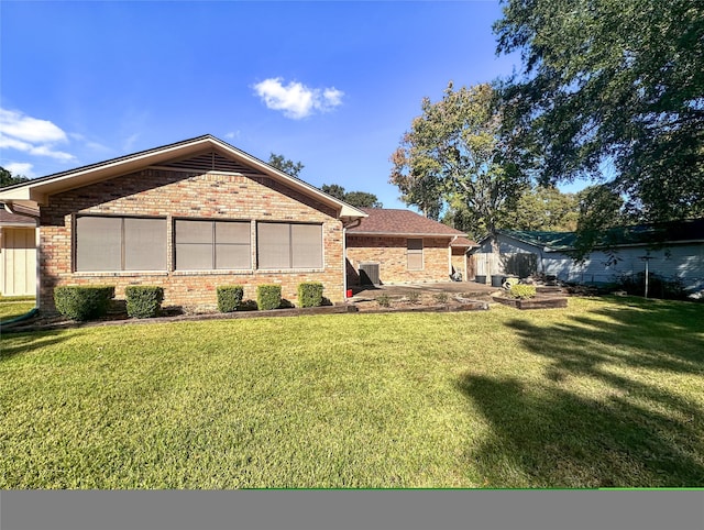 view of home's exterior with a lawn