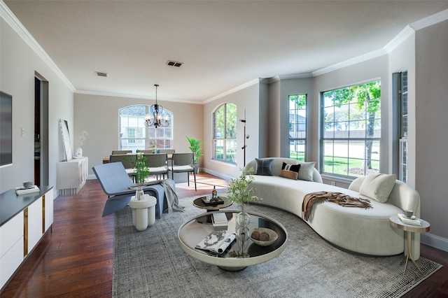 living room with wood finished floors, visible vents, and a healthy amount of sunlight