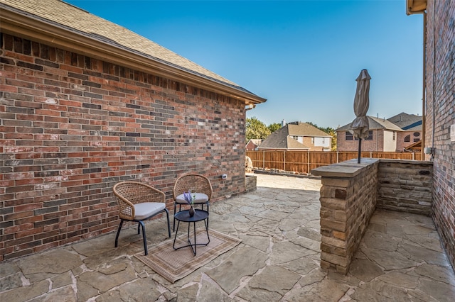 view of patio / terrace featuring fence