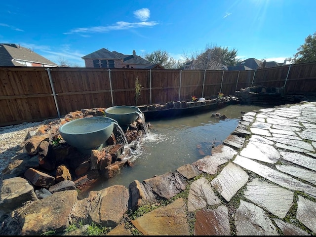 view of swimming pool with fence