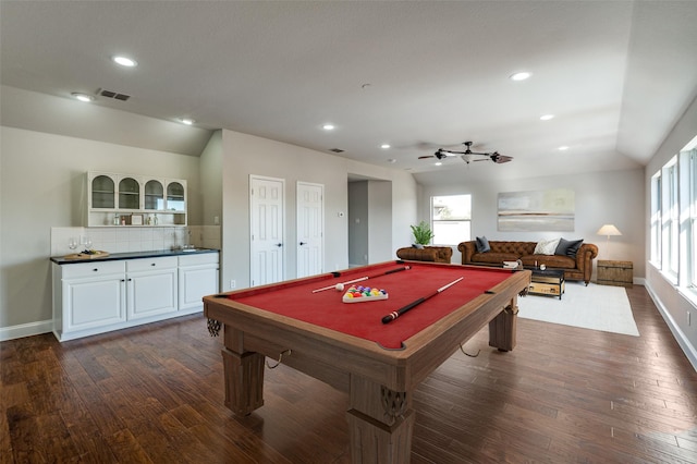 game room with vaulted ceiling, dark wood-type flooring, visible vents, and recessed lighting