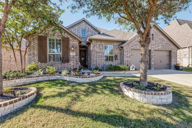 view of front of home featuring a garage and a front lawn