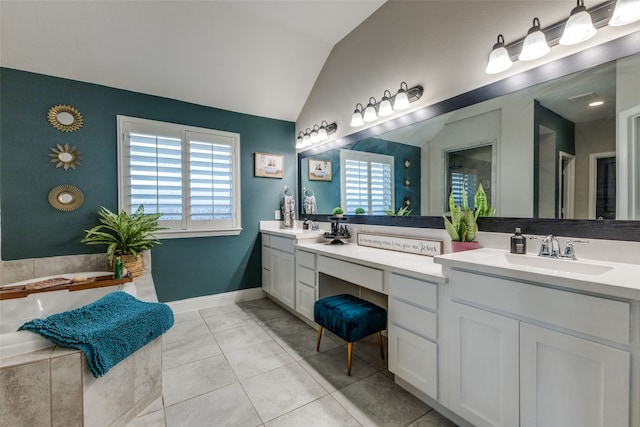 bathroom with tile patterned floors, vanity, a healthy amount of sunlight, and lofted ceiling