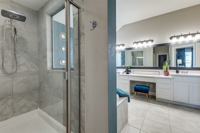 bathroom with tile patterned flooring, vanity, an enclosed shower, and lofted ceiling