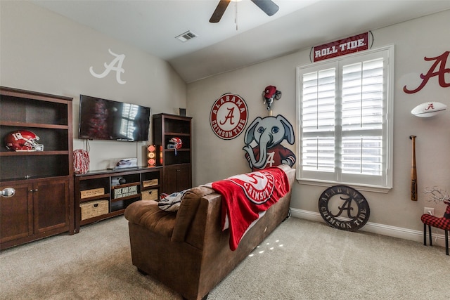 bedroom featuring light colored carpet, vaulted ceiling, and ceiling fan