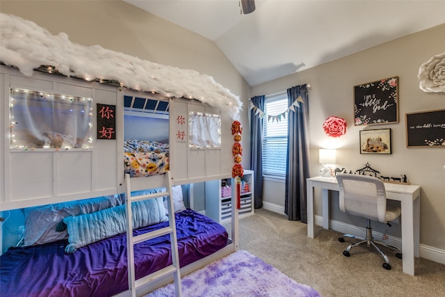 carpeted bedroom with ceiling fan and vaulted ceiling