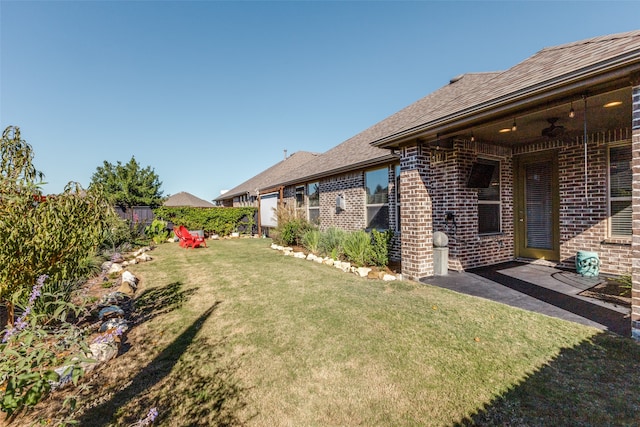 view of yard featuring ceiling fan