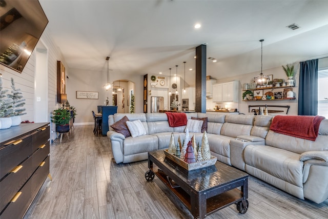 living room with light hardwood / wood-style flooring