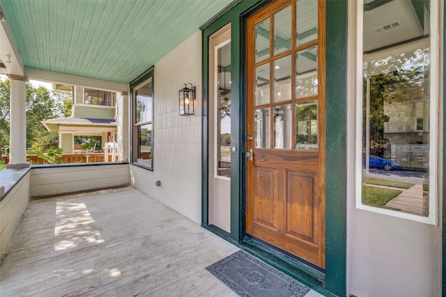 doorway to property featuring a porch