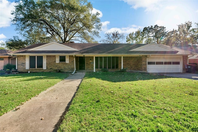 ranch-style home featuring a front yard and a garage