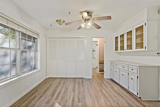 2680 Hubbard St, Paris, TX 75460 - unfurnished bedroom featuring light wood-style flooring, a closet, baseboards, and ceiling fan