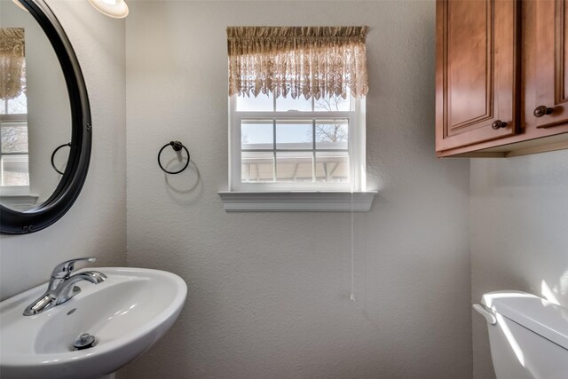 bathroom with toilet and sink