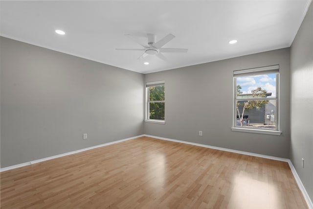 spare room featuring ceiling fan and light hardwood / wood-style flooring