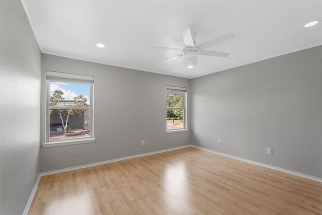 unfurnished room featuring light hardwood / wood-style floors and ceiling fan