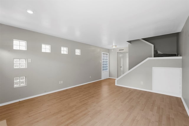 unfurnished room with light hardwood / wood-style floors