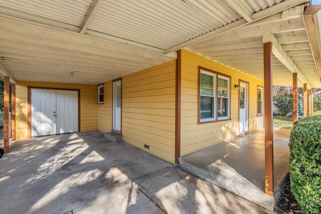 view of patio / terrace with a carport