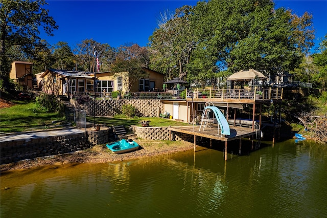 view of dock featuring a gazebo and a water view