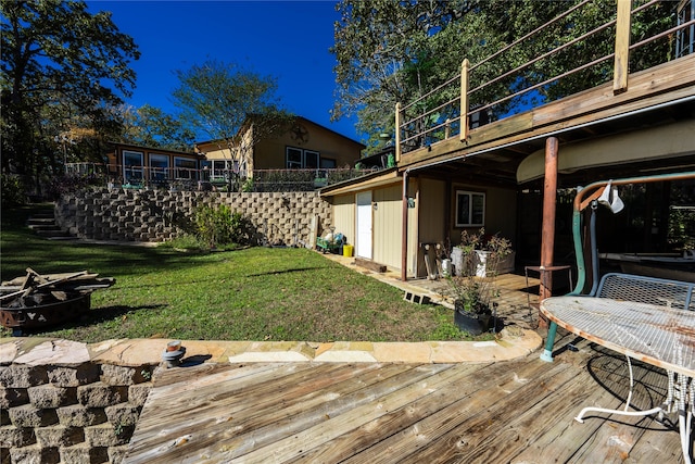 wooden deck with a lawn