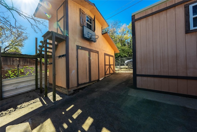 view of side of home with an outdoor structure