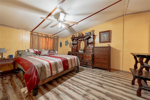 bedroom featuring vaulted ceiling, ceiling fan, and light hardwood / wood-style flooring