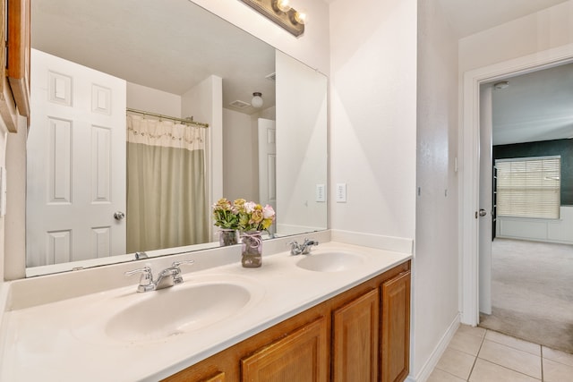 bathroom featuring tile patterned floors and vanity