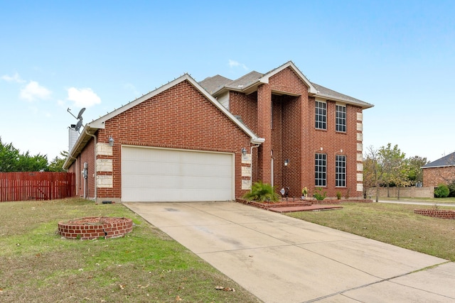 view of front of property featuring a garage and a front yard