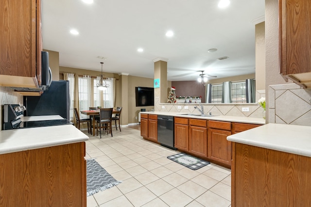 kitchen with sink, backsplash, plenty of natural light, and black appliances