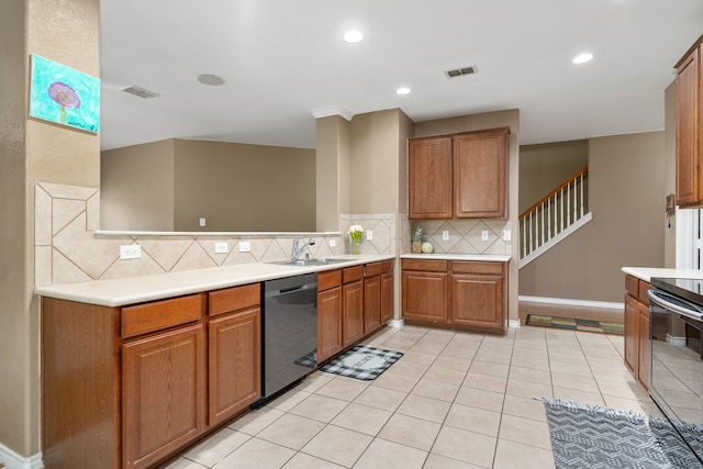 kitchen with dishwasher, sink, light tile patterned floors, tasteful backsplash, and stainless steel stove