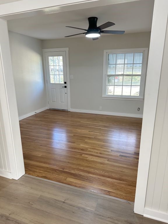 entrance foyer featuring ceiling fan and light wood-type flooring