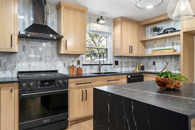 kitchen with light brown cabinets, black stove, wall chimney range hood, and sink