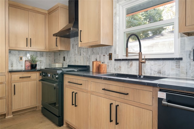 kitchen with wall chimney exhaust hood, black range oven, sink, light brown cabinets, and dishwasher