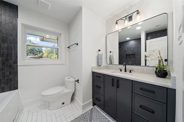 bathroom featuring toilet, vanity, and tile patterned floors