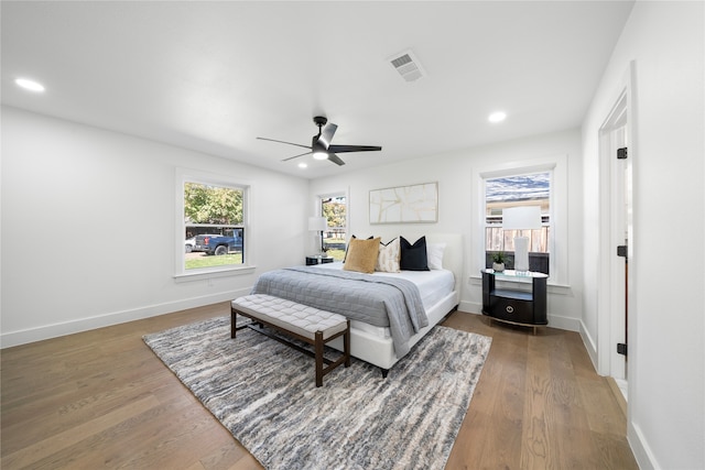 bedroom featuring ceiling fan and dark hardwood / wood-style flooring