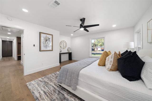 bedroom with hardwood / wood-style floors and ceiling fan